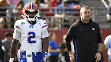 Nov 2, 2024; Jacksonville, Florida, USA; Florida Gators head coach Billy Napier and quarterback DJ Lagway (2) before a game against the Georgia Bulldogs at EverBank Stadium. Mandatory Credit: Melina Myers-Imagn Images