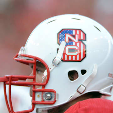 Sep 7, 2013; Raleigh, NC, USA; North Carolina State Wolfpack player Alex Barr (71) looks on from the bench during the first half against the Richmond Spiders at Carter Finley Stadium.  North Carolina State Wolfpack players wore specially designed helmets for military appreciation day. Mandatory Credit: Rob Kinnan-Imagn Images