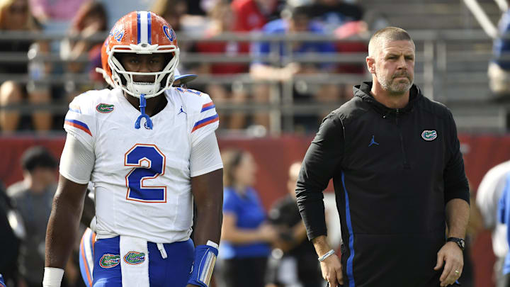 Nov 2, 2024; Jacksonville, Florida, USA; Florida Gators head coach Billy Napier and quarterback DJ Lagway (2) before a game against the Georgia Bulldogs at EverBank Stadium. Mandatory Credit: Melina Myers-Imagn Images