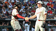 Jun 13, 2025; Omaha, Neb, USA; Louisville Cardinals catcher Matt Klein (25) greets starting pitcher Patrick Forbes (1) after the first inning against the Oregon State Beavers at Charles Schwab Field. Mandatory Credit: Steven Branscombe-Imagn Images