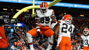Dec 2, 2024; Denver, Colorado, USA; Cleveland Browns tight end David Njoku (85) spikes the ball next to running back Nick Chubb (24) after scoring a touchdown against the Denver Broncos at Empower Field at Mile High. Mandatory Credit: Isaiah J. Downing-Imagn Images