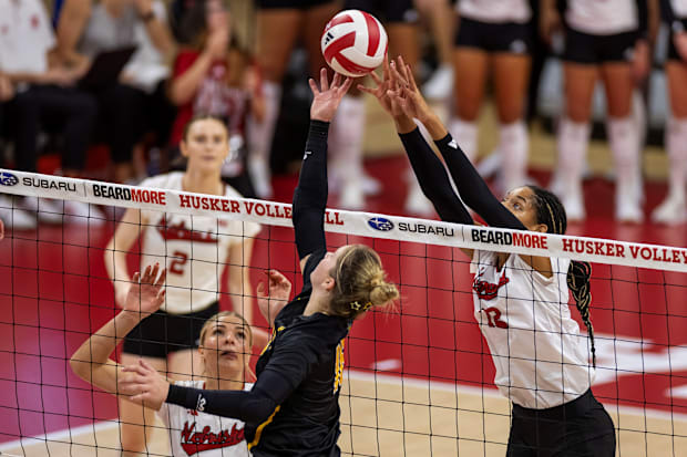 Nebraska volleyball's Taylor Landfair jousts at the net against Wichita State.