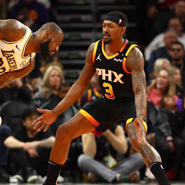 Nov 26, 2024; Phoenix, Arizona, USA; Los Angeles Lakers forward LeBron James (23) against Phoenix Suns guard Bradley Beal (3) during an NBA Cup game at Footprint Center. Mandatory Credit: Mark J. Rebilas-Imagn Images
