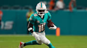 Sep 30, 2024; Miami Gardens, Florida, USA; Miami Dolphins wide receiver Tyreek Hill (10) runs with the ball during the first half against the Tennessee Titans at Hard Rock Stadium. Mandatory Credit: Jasen Vinlove-Imagn Images