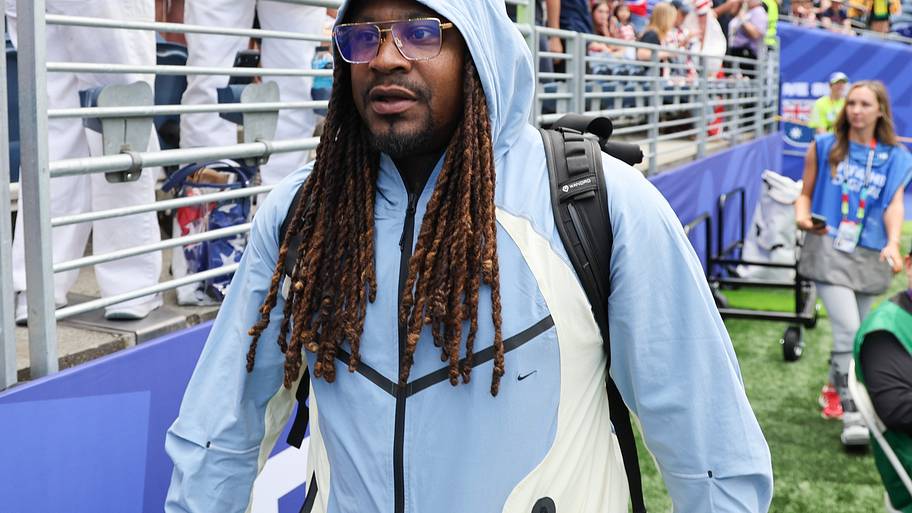 Marshawn Lynch under a hood.