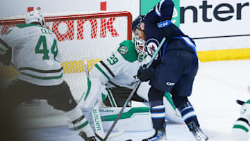 May 7, 2025; Winnipeg, Manitoba, CAN; Dallas Stars defenseman Cody Ceci (44) and Winnipeg Jets forward Gabriel Vilardi (13) battle for the puck in front of Dallas Stars goalie Jake Oettinger (29) during the third period in game one of the second round of the 2025 Stanley Cup Playoffs at Canada Life Centre. Mandatory Credit: Terrence Lee-Imagn Images