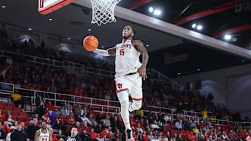 Dec 28, 2024; Queens, New York, USA; St. John's basketball guard Deivon Smith (5) goes up for a dunk attempt in the second half against the Delaware Fightin Blue Hens at Carnesecca Arena.