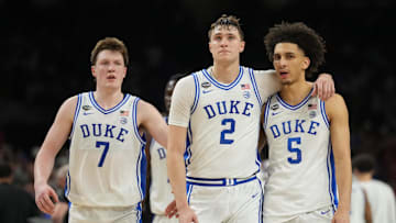 Apr 5, 2025; San Antonio, TX, USA;  Duke Blue Devils forward Cooper Flagg (2) and Duke Blue Devils guard Tyrese Proctor (5) react against the Houston Cougars in the semifinals of the men's Final Four of the 2025 NCAA Tournament at the Alamodome. Mandatory Credit: Robert Deutsch-Imagn Images