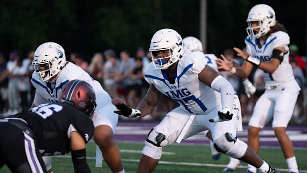 IMG's Jordan Seaton (77) protects his quarterback against a Lipscomb defender at Lipscomb's Reese Smith Football Field in Nas
