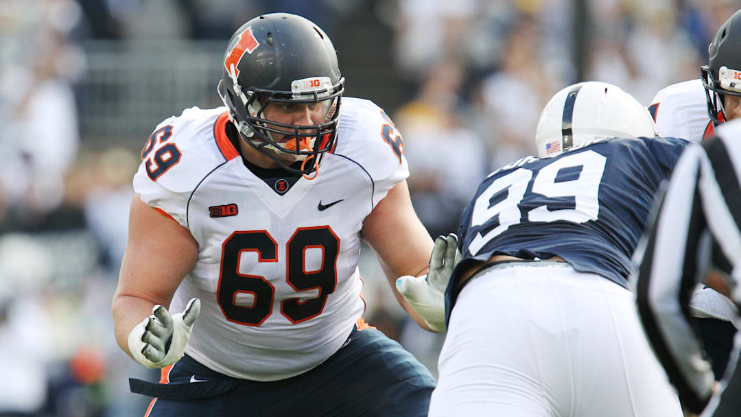 Nov 2, 2013; University Park, PA, USA; Illinois Fighting Illini offensive lineman Ted Karras (69) blocks during the first quarter against the Penn State Nittany Lions at Beaver Stadium.