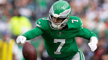 Dec 29, 2024; Philadelphia, Pennsylvania, USA; Philadelphia Eagles quarterback Kenny Pickett (7) fumbles the ball during the second quarter against the Dallas Cowboys at Lincoln Financial Field. Mandatory Credit: Bill Streicher-Imagn Images