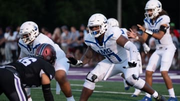 IMG's Jordan Seaton (77) protects his quarterback against a Lipscomb defender at Lipscomb's Reese