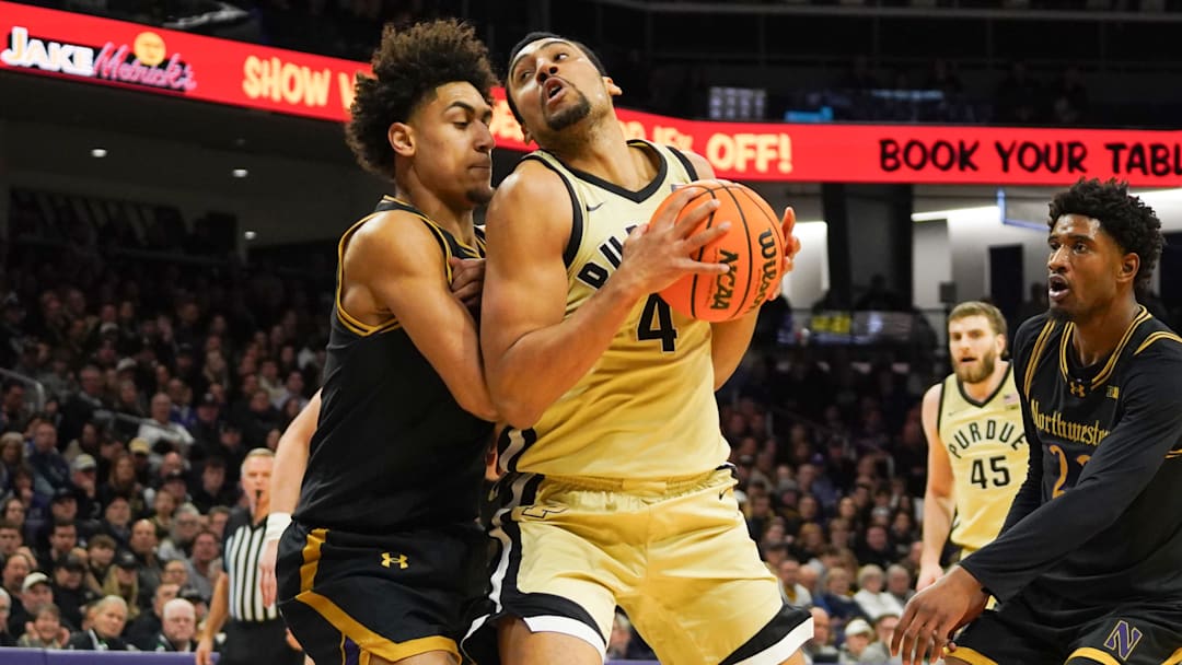 Northwestern Wildcats forward Tre Singleton (8) defends Purdue Boilermakers forward Trey Kaufman-Renn (4).