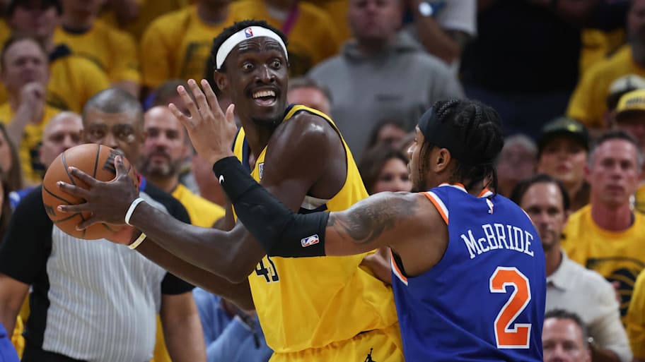Siakam looks for an outlet while defended by Knicks guard Miles McBride during the Eastern Conference finals.