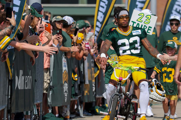 Green Bay Packers cornerback Jaire Alexander (23) rides to practice