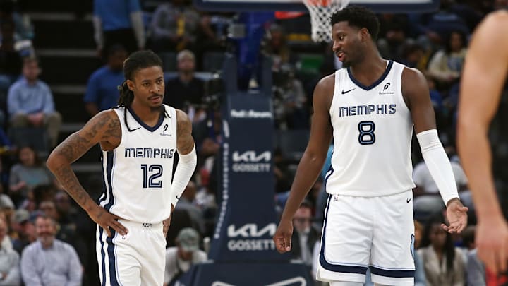 Nov 5, 2025; Memphis, Tennessee, USA; Memphis Grizzlies forward/center Jaren Jackson Jr. (8) talks with guard Ja Morant (12) during the second quarter against the Houston Rockets at FedExForum. Mandatory Credit: Petre Thomas-Imagn Images