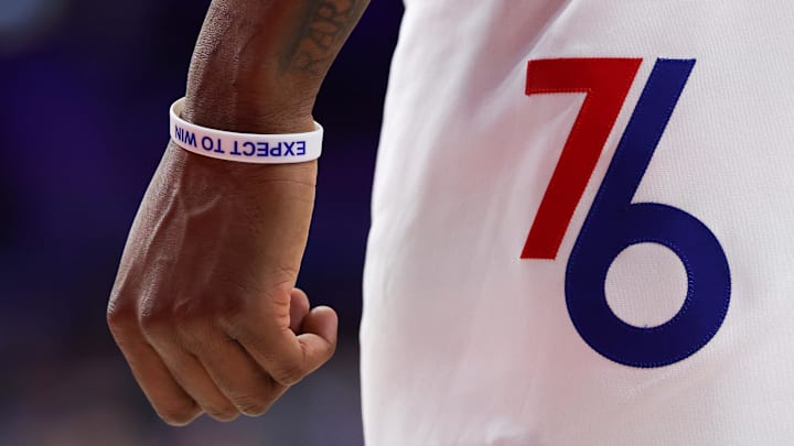 Mar 3, 2025; Philadelphia, Pennsylvania, USA; The wrist of Philadelphia 76ers forward Justin Edwards (19) wearing a bracelet during the fourth quarter against the Portland Trail Blazers at Wells Fargo Center. Mandatory Credit: Bill Streicher-Imagn Images