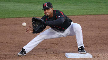 Rochester second baseman Richie Martin takes the throw and turns a double play against Worcester.
