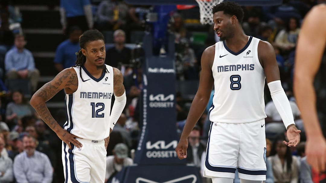 Nov 5, 2025; Memphis, Tennessee, USA; Memphis Grizzlies forward/center Jaren Jackson Jr. (8) talks with guard Ja Morant (12) during the second quarter against the Houston Rockets at FedExForum. Mandatory Credit: Petre Thomas-Imagn Images