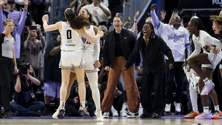 Golden State Valkyries guard Veronica Burton (22) and guard Carla Leite (0) and other players celebrate after Burton scored against the Dallas Wings during the second half at Chase Center. Golden State Valkyries guard Veronica Burton (22) and guard Carla Leite (0) and other players celebrate after Burton scored against the Dallas Wings during the second half at Chase Center.