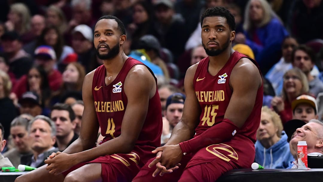 Apr 2, 2025; Cleveland, Ohio, USA;  Cleveland Cavaliers forward Evan Mobley (4) and guard Donovan Mitchell (45) wait along side head coach Kenny Atkinson to enter the game during the first half against the New York Knicks at Rocket Arena. Mandatory Credit: Ken Blaze-Imagn Images