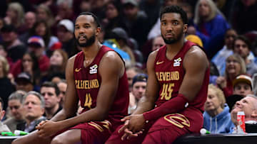 Apr 2, 2025; Cleveland, Ohio, USA;  Cleveland Cavaliers forward Evan Mobley (4) and guard Donovan Mitchell (45) wait along side head coach Kenny Atkinson to enter the game during the first half against the New York Knicks at Rocket Arena. Mandatory Credit: Ken Blaze-Imagn Images