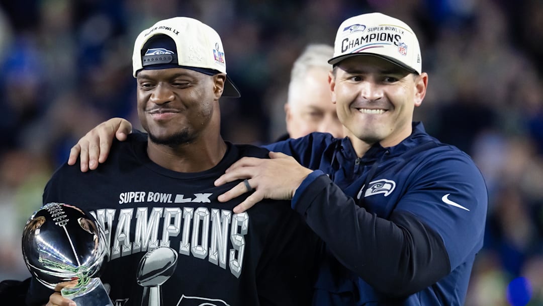 Feb 8, 2026; Santa Clara, CA, USA; Seattle Seahawks head coach Mike MacDonald and running back Kenneth Walker III (9) celebrate with the Vince Lombardi trophy after defeating the New England Patriots in Super Bowl LX at Levi's Stadium.