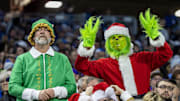 Dec 11, 2022; Detroit, Michigan, USA; Detroit Lions fans dressed up in a Christmas theme during the first quarter of a game against the Minnesota Vikings at Ford Field. Mandatory Credit: David Reginek-Imagn Images