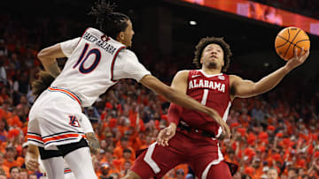 Feb 7, 2024; Auburn, Alabama, USA; Alabama Crimson Tide guard Mark Sears (1) takes a shot as Auburn Tigers guard Chad Baker-Mazara (10) defends during the first half at Neville Arena. Mandatory Credit: John Reed-Imagn Images