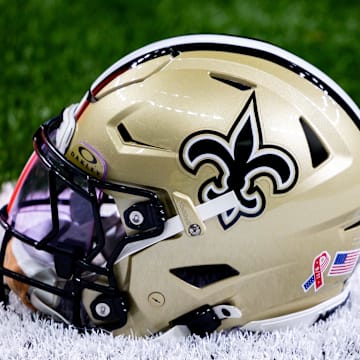 Sep 8, 2024; New Orleans, Louisiana, USA;  Detailed view of the New Orleans Saints football helmet before the game against the Carolina Panthers during the pregame at Caesars Superdome. Mandatory Credit: Stephen Lew-Imagn Images