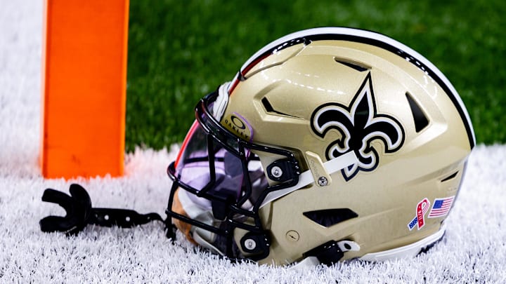 Sep 8, 2024; New Orleans, Louisiana, USA; Detailed view of the New Orleans Saints football helmet before the game against the Carolina Panthers during the pregame at Caesars Superdome. Mandatory Credit: Stephen Lew-Imagn Images Sep 8, 2024; New Orleans, Louisiana, USA; Detailed view of the New Orleans Saints football helmet before the game against the Carolina Panthers during the pregame at Caesars Superdome. Mandatory Credit: Stephen Lew-Imagn Images