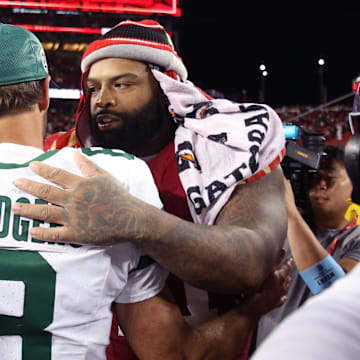 Sep 9, 2024; Santa Clara, California, USA; New York Jets quarterback Aaron Rodgers (8) greets San Francisco 49ers offensive tackle Trent Williams (71) after a game at Levi's Stadium. Mandatory Credit: David Gonzales-Imagn Images