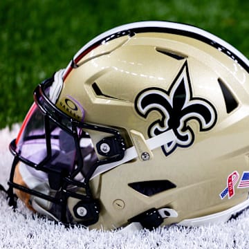 Sep 8, 2024; New Orleans, Louisiana, USA;  Detailed view of the New Orleans Saints football helmet before the game against the Carolina Panthers during the pregame at Caesars Superdome. Mandatory Credit: Stephen Lew-Imagn Images