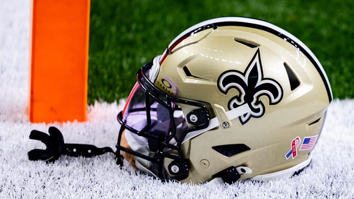 Sep 8, 2024; New Orleans, Louisiana, USA;  Detailed view of the New Orleans Saints football helmet before the game against the Carolina Panthers during the pregame at Caesars Superdome. Mandatory Credit: Stephen Lew-Imagn Images