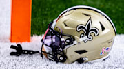 Sep 8, 2024; New Orleans, Louisiana, USA;  Detailed view of the New Orleans Saints football helmet before the game against the Carolina Panthers during the pregame at Caesars Superdome. Mandatory Credit: Stephen Lew-Imagn Images