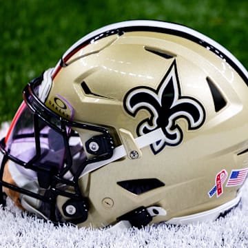 Sep 8, 2024; New Orleans, Louisiana, USA;  Detailed view of the New Orleans Saints football helmet before the game against the Carolina Panthers during the pregame at Caesars Superdome. Mandatory Credit: Stephen Lew-Imagn Images