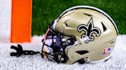 Sep 8, 2024; New Orleans, Louisiana, USA;  Detailed view of the New Orleans Saints football helmet before the game against the Carolina Panthers during the pregame at Caesars Superdome. Mandatory Credit: Stephen Lew-Imagn Images