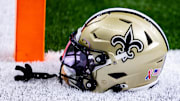 Sep 8, 2024; New Orleans, Louisiana, USA;  Detailed view of the New Orleans Saints football helmet before the game against the Carolina Panthers during the pregame at Caesars Superdome. Mandatory Credit: Stephen Lew-Imagn Images