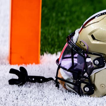 Sep 8, 2024; New Orleans, Louisiana, USA;  Detailed view of the New Orleans Saints football helmet before the game against the Carolina Panthers during the pregame at Caesars Superdome. Mandatory Credit: Stephen Lew-Imagn Images