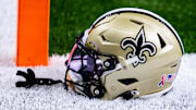 Sep 8, 2024; New Orleans, Louisiana, USA;  Detailed view of the New Orleans Saints football helmet before the game against the Carolina Panthers during the pregame at Caesars Superdome. Mandatory Credit: Stephen Lew-Imagn Images