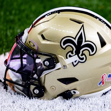 Sep 8, 2024; New Orleans, Louisiana, USA;  Detailed view of the New Orleans Saints football helmet before the game against the Carolina Panthers during the pregame at Caesars Superdome. Mandatory Credit: Stephen Lew-Imagn Images