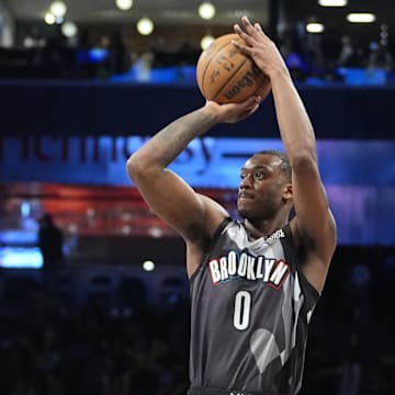 Apr 6, 2025; Brooklyn, New York, USA; Brooklyn Nets forward Dariq Whitehead (0) shoots a three point jump shot against the Toronto Raptors during the second half at Barclays Center. Mandatory Credit: Gregory Fisher-Imagn Images
