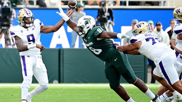  Michigan State Spartans defensive lineman Simeon Barrow Jr. (8) breaks up a pass by Washington Huskies quarterback Michael P