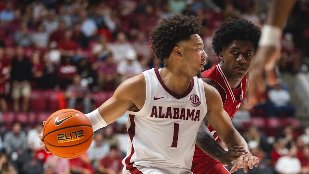 Nov 8, 2024; Tuscaloosa, Alabama, USA; Alabama Crimson Tide guard Mark Sears (1) works against Arkansas State Red Wolves guard Terrance Ford Jr. (11) during the first half at Coleman Coliseum. Mandatory Credit: Will McLelland-Imagn Images