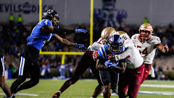 Oct 18, 2024; Durham, North Carolina, USA; Duke Blue Devils quarterback Maalik Murphy (6) attempts to run the ball to the end zone but is tackled by Florida State Seminoles defensive lineman Darrell Jackson Jr. (6) during the first half of the game at Wallace Wade Stadium. Mandatory Credit: Jaylynn Nash-Imagn Images