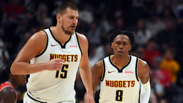 Oct 14, 2025; Denver, Colorado, USA; Denver Nuggets forward Peyton Watson (8) after scoring on an assist by  center Nikola Jokic (15) during the first half at Ball Arena. Mandatory Credit: Christopher Hanewinckel-Imagn Images