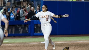 Jun 6, 2025; Oklahoma City, OK, USA;  Texas Longhorns utility Mia Scott (10) runs towards her team to celebrate their win over the Texas Tech Red Raiders 10-4 to win the National Championship in game three of the NCAA Softball Women's College World Series finals at Devon Park. Mandatory Credit: Brett Rojo-Imagn Images