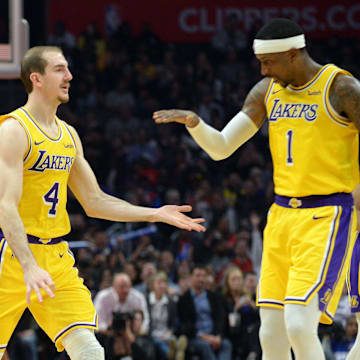 April 5, 2019; Los Angeles, CA, USA; Los Angeles Lakers guard Alex Caruso (4) celebrates with guard Kentavious Caldwell-Pope (1) after scoring a three point basket against the Los Angeles Clippers during the second half at Staples Center. Mandatory Credit: Gary A. Vasquez-Imagn Images
