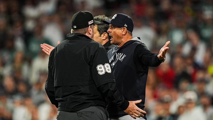 Jun 13, 2025; Boston, Massachusetts, USA; New York Yankees manager Aaron Boone (17) has words with the officials as they take on the Boston Red Sox in the tenth inning at Fenway Park. Mandatory Credit: David Butler II-Imagn Images