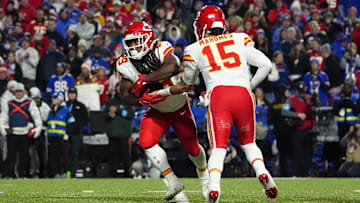 Nov 17, 2024; Orchard Park, New York, USA; Kansas City Chiefs quarterback Patrick Mahomes (15) hands the ball off to Kansas City Chiefs running back Kareem Hunt (29) against the Buffalo Bills during the second half at Highmark Stadium. Mandatory Credit: Gregory Fisher-Imagn Images